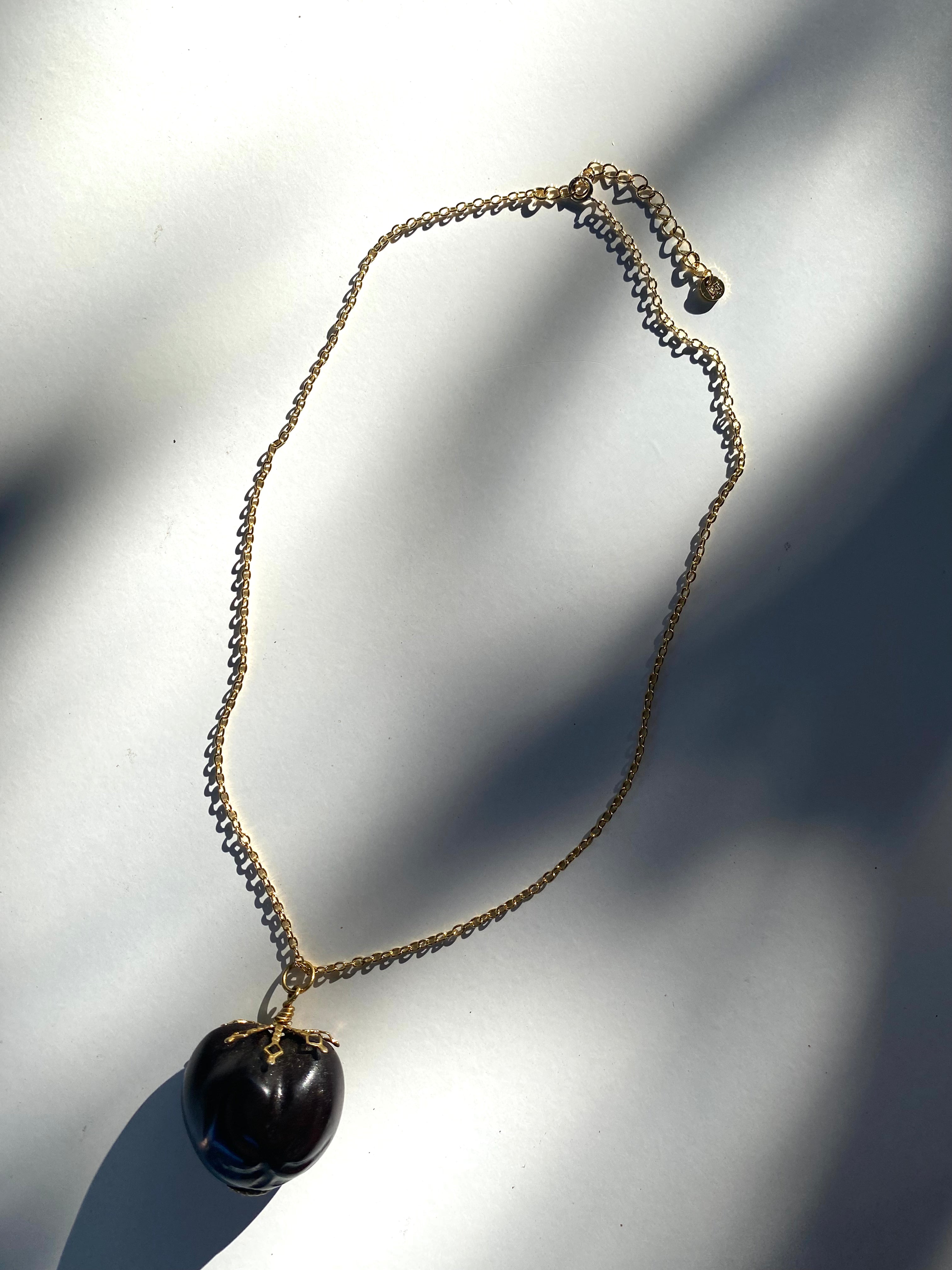 Filigree Detailed Liliʻuokalani Kukui pendant necklace